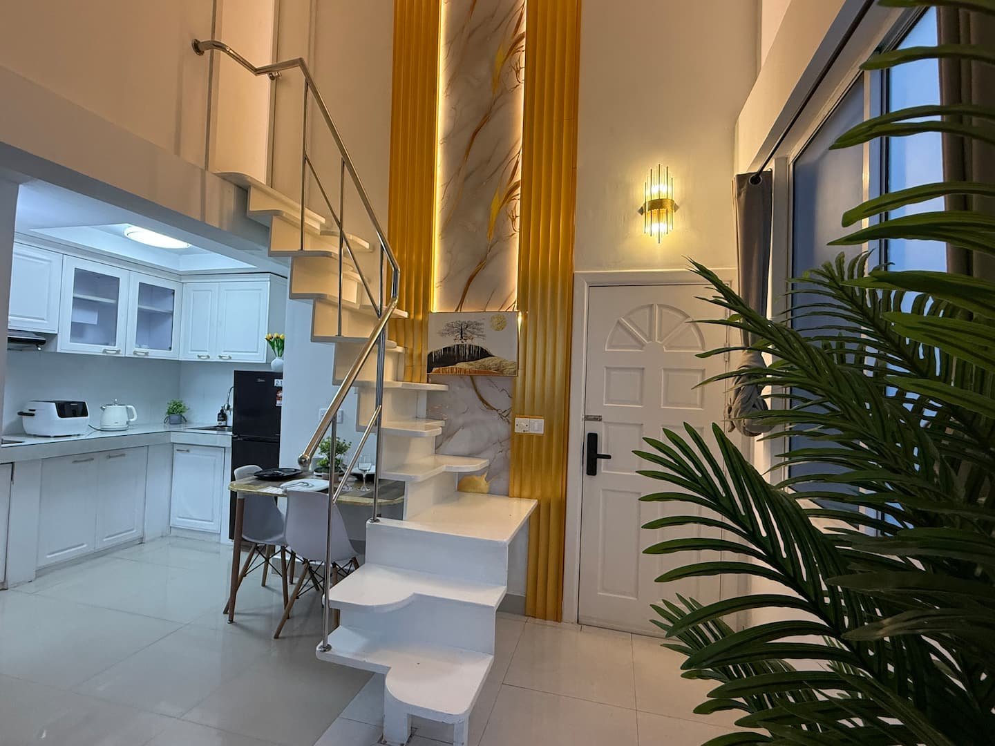 Breezy Home – Open-plan living and loft stairs